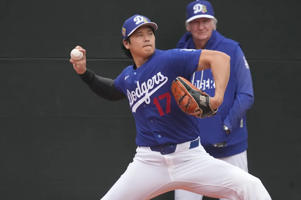 Los Angeles Dodgers pitcher Shohei Ohtani (17) throws in the bullpen during spring training camp.