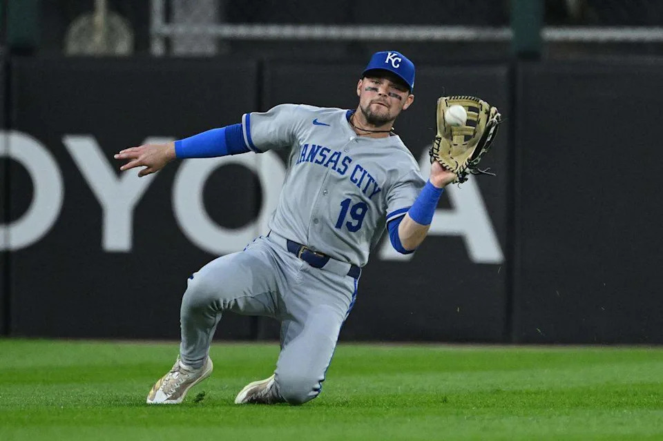 Royals infielder Michael Massey makes a sliding catch during a game against the White Sox at Rate Field in Chicago on Aug. 27, 2025.