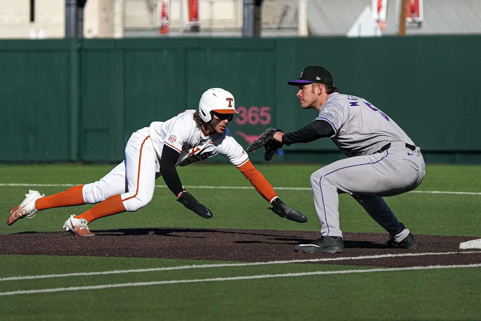 Texas Longhorns outfielder Aiden Robbins (43) dives to beat the tag by Colorado first baseman Skyler Messinger during the annual Texas Longhorns Alumni Baseball Game at UFCU Disch-Falk Field on Saturday, Jan. 31, 2026 in Austin. (Aaron E. Martinez/Austin American-Statesman)