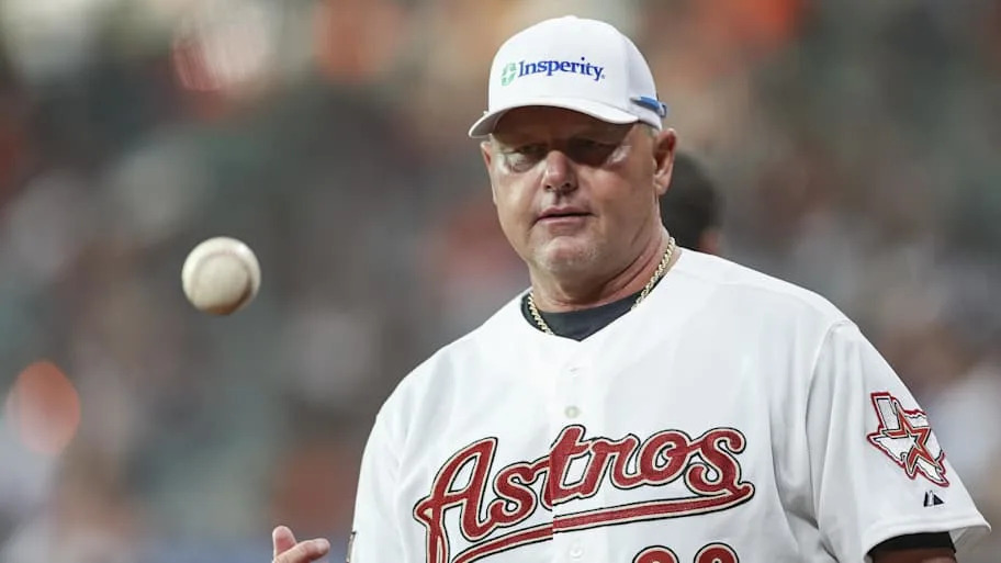 Houston Astros former pitcher Roger Clemens tossing a baseball into the ai