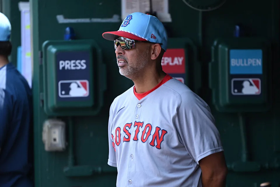 Jul 4, 2025; Washington, District of Columbia, USA; Boston Red Sox manager Alex Cora (13) stands in the dugout during the eighth inning of a game against the Washington Nationals at Nationals Park.Rafael Suanes-Imagn Images