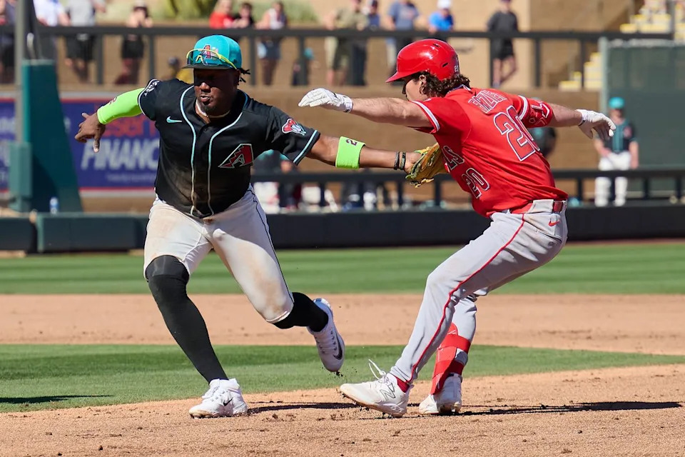 The Los Angeles Angels infielder Adam Frazier (20) gets tagged out  against The Arizona Diamondbacks ,February 22nd, 2026 in Scottsdale Arizona.