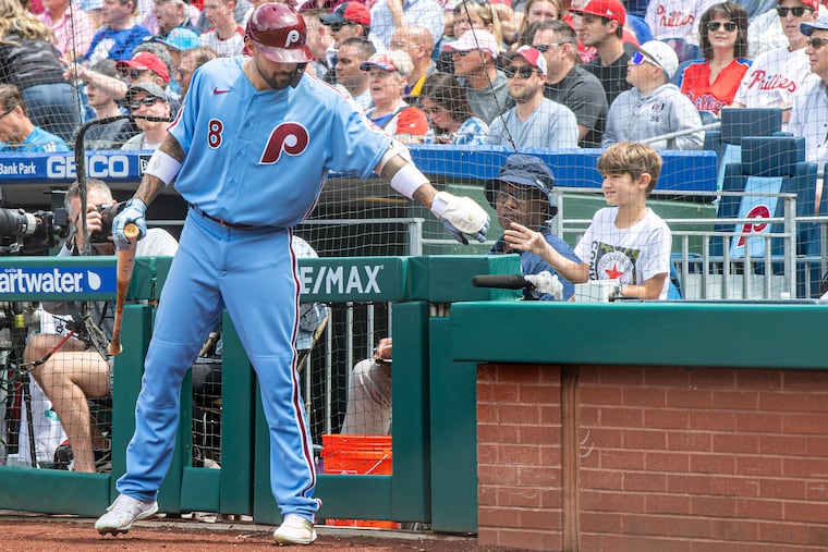 Phillies right fielder Nick Castellanos interacts with his son Liam in May 2022. Liam became a fixture during a few playoff runs.
