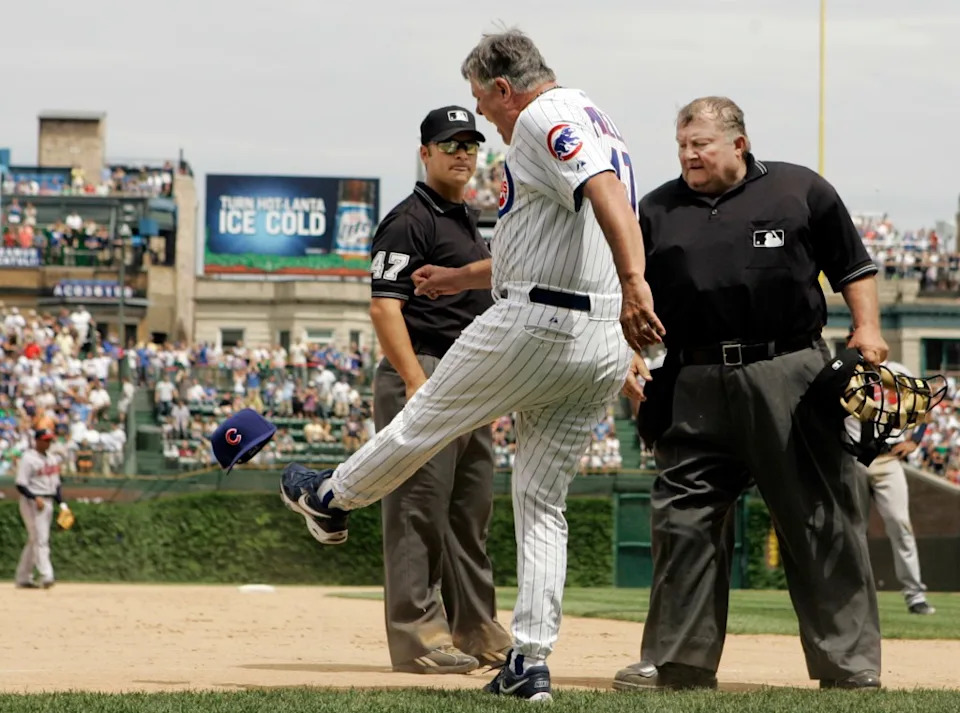 Chicago Cubs manager Lou Piniella, center, kicks his hat as he argues with third base umpire Mark Wegner, left, and home plate umpire Bruce Froemming watches during the eighth inning of a baseball game against Atlanta Braves, Saturday, June 2, 2007. AP