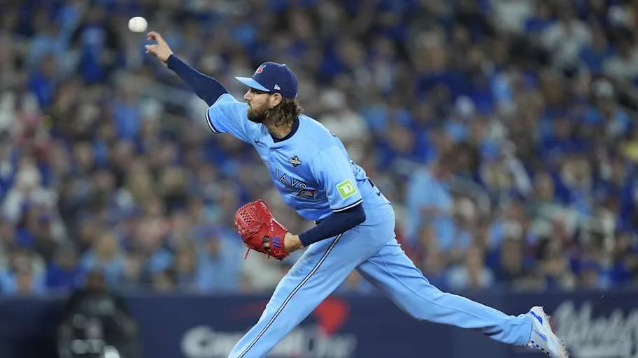 Gausman releases a baseball against the Dodgers in a blue uniform at Rogers Centr