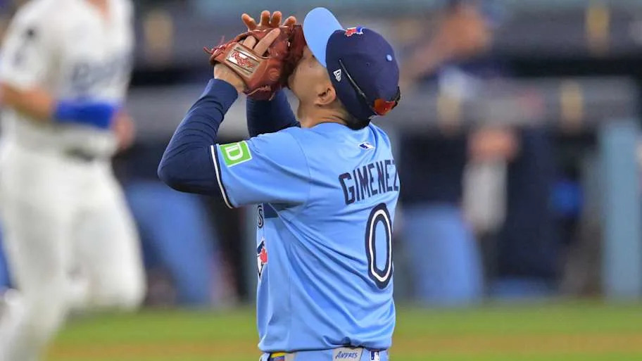 Blue Jays' Andres Gimenez kisses his glove