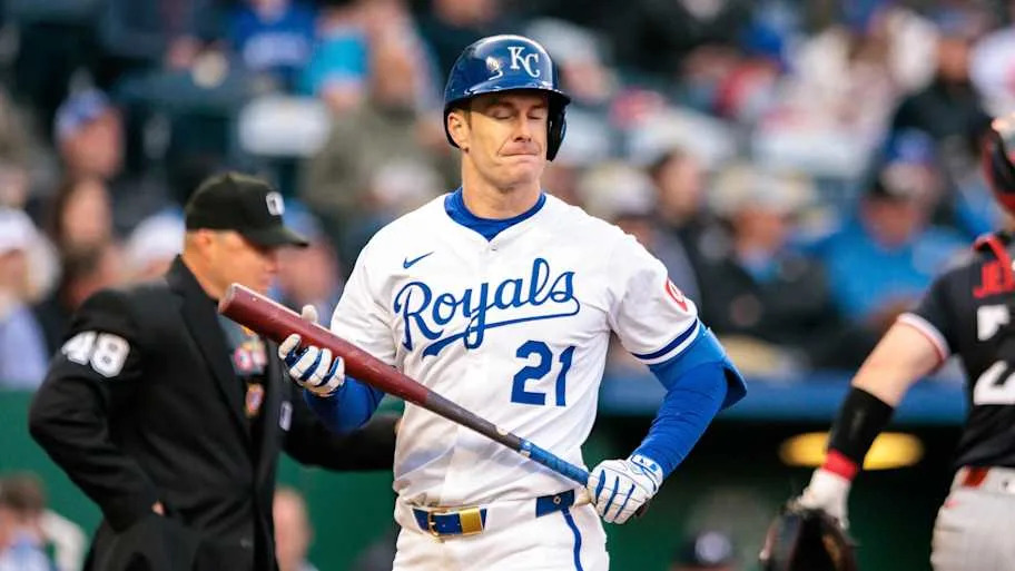 Kansas City Royals Mark Canha closes his eyes and holds his bat after striking out.