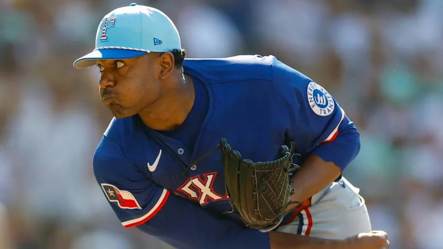 Texas Rangers starting pitcher Kumar Rocker follows through on a pitch.