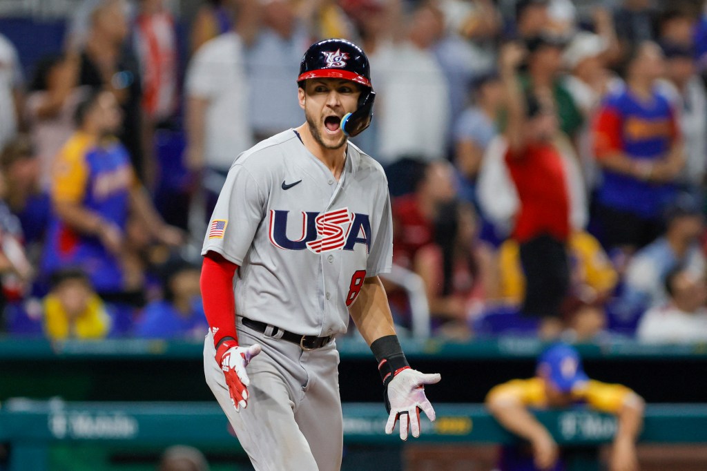 USA shortstop Trea Turner reacting after hitting a grand slam.