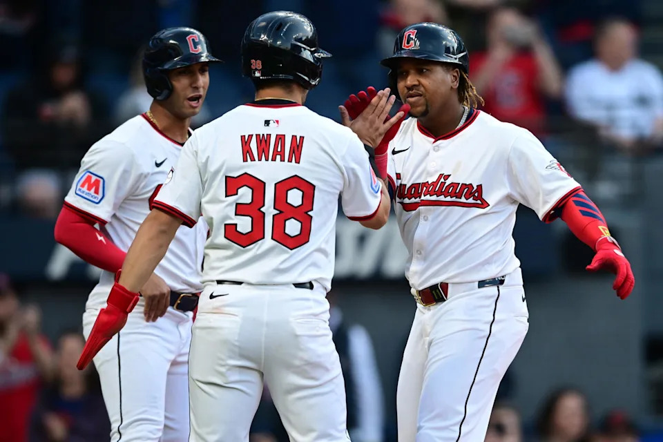 Apr 21, 2025; Cleveland, Ohio, USA; Cleveland Guardians third baseman Jose Ramirez (11) is congratulated by left fielder Steven Kwan (38) and shortstop Brayan Rocchio (4) after hitting a three run home run off New York Yankees starting pitcher Clarke Schmidt (36) during the third inning at Progressive Field. Mandatory Credit: David Dermer-Imagn Images