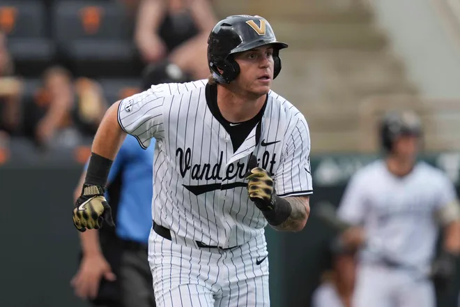 Vanderbilt infielder Braden Holcomb (26) runs to first base during a NCAA baseball game between the Tennessee Volunteers and Vanderbilt Commodores at Lindsey Nelson Stadium on May 11, 2025.