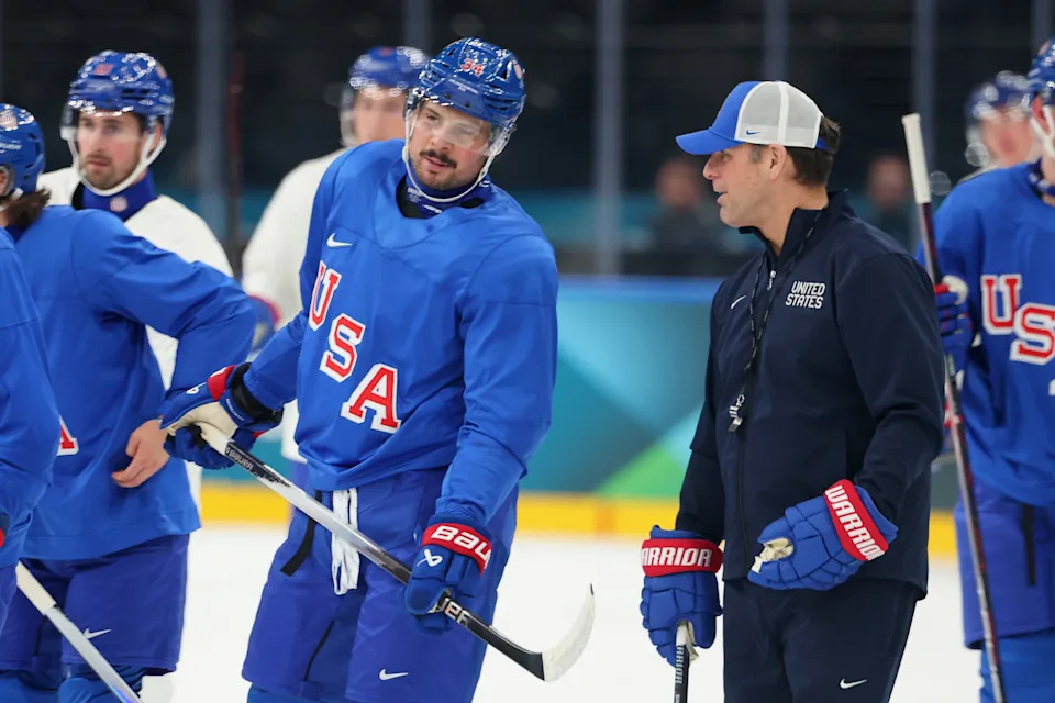 MILAN, ITALY - FEBRUARY 08: Auston Matthews #34 of Team United States speaks with head coach Mike Sullivan during training on day two of the Milano Cortina 2026 Winter Olympic games at Milano Santagiulia Ice Hockey Arena on February 08, 2026 in Milan, Italy. (Photo by Gregory Shamus/Getty Images)