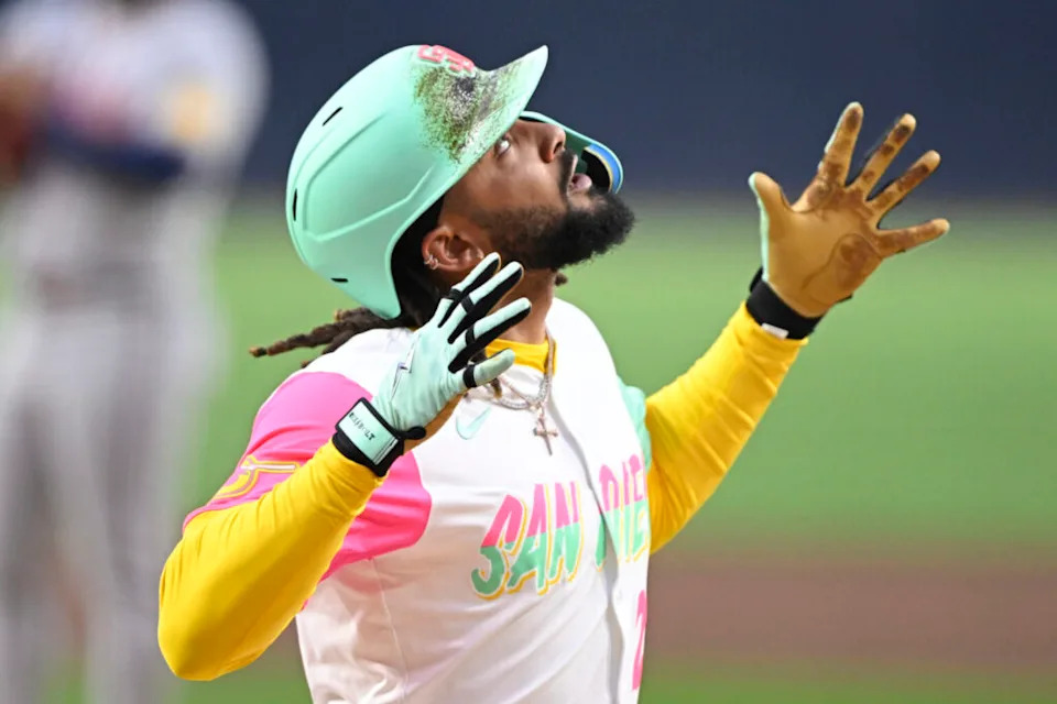 Mar 28, 2025; San Diego, California, USA; San Diego Padres right fielder Fernando Tatis Jr. (23) looks skyward after hitting a solo home run during first inning against the Atlanta Braves at Petco Park. Mandatory Credit: Denis Poroy-Imagn Images