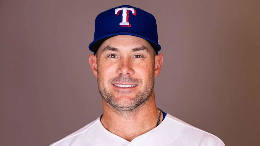 Skip smiles in a Rangers uniform.