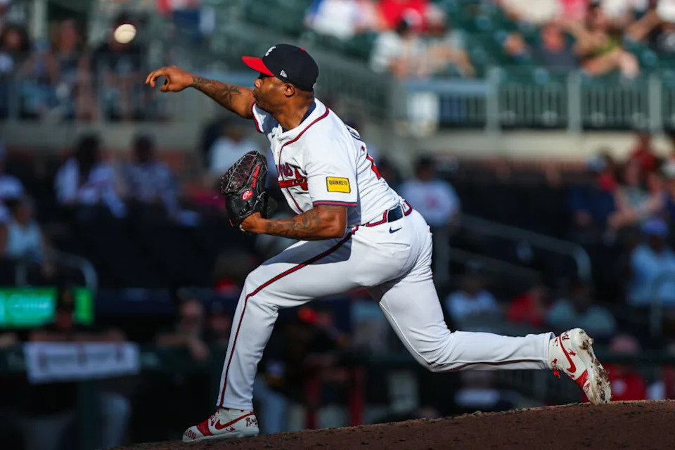Sep 28, 2025; Cumberland, Georgia, USA; Atlanta Braves pitcher Raisel Iglesias (26) pitches the ball against the Pittsburgh Pirates during the ninth inning at Truist Park. Mandatory Credit: Jordan Godfree-Imagn Images