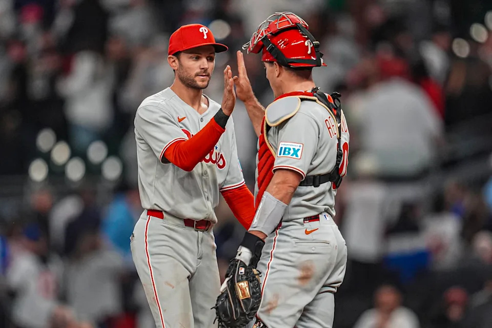 Apr 9, 2025; Cumberland, Georgia, USA; Philadelphia Phillies shortstop Trea Turner (7) reacts with catcher J.T. Realmuto (10) after the Phillies defeated the Atlanta Braves at Truist Park. Mandatory Credit: Dale Zanine-Imagn Images