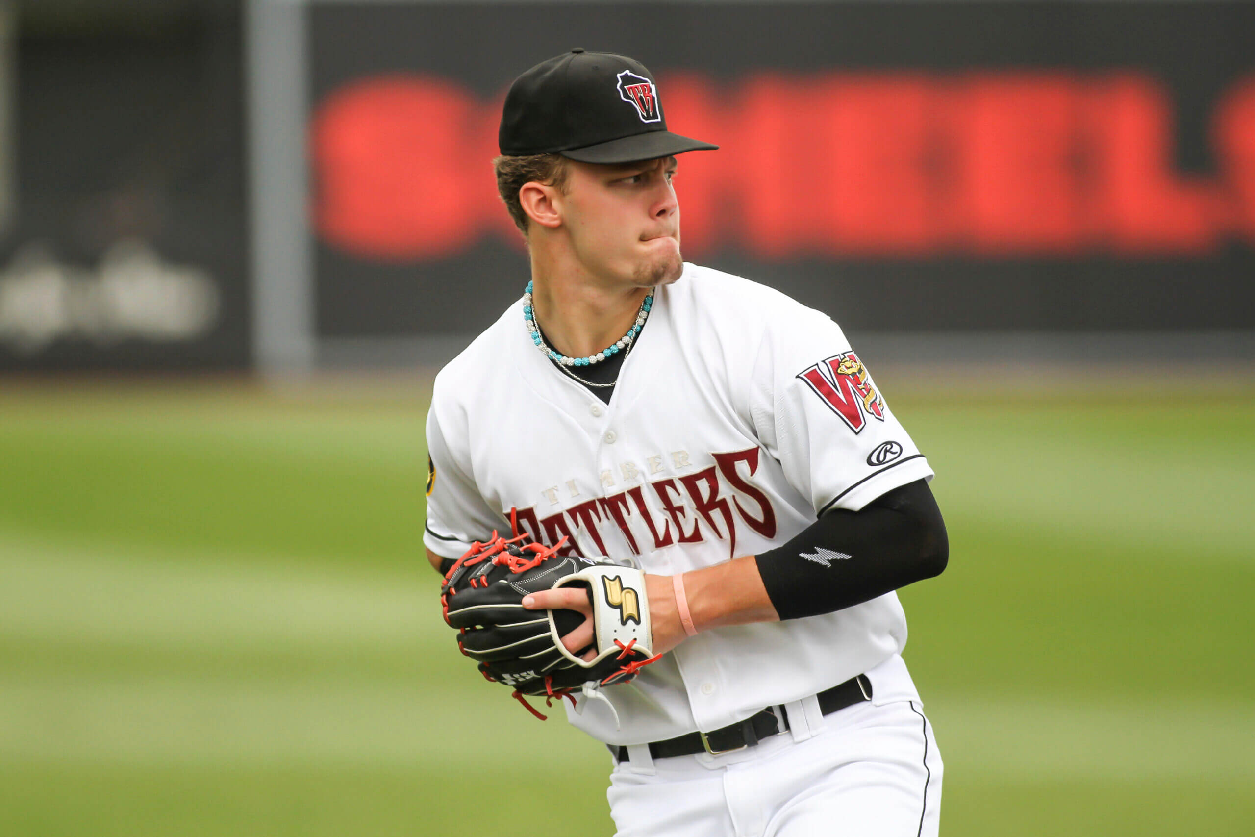 Wisconsin Timber Rattlers third baseman Brock Wilken (25) makes a warmup throw to first base prior to the start of a Midwest League game against the Cedar Rapids Kernels on September 6, 2023 at Fox Cities Stadium in Grand Chute, Wisconsin. 