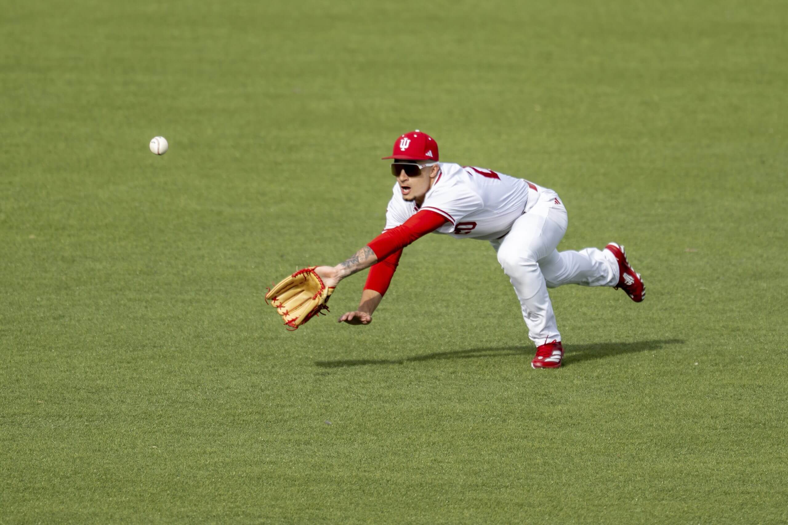 Indiana outfielder Korbyn Dickerson (20) makes a diving effort to successfully catch a fly ball hit to center field during an NCAA baseball game against Northern Kentucky on Tuesday, March 4, 2024, in Bloomington, Ind. 