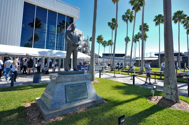 A statue of George M. Steinbrenner stands outside George M. Steinbrenner Field during a spring training baseball game.