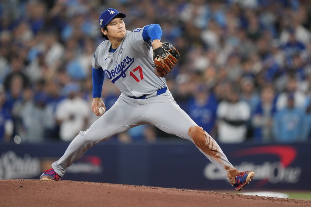 Los Angeles Dodgers pitcher Shohei Ohtani throwing a baseball.