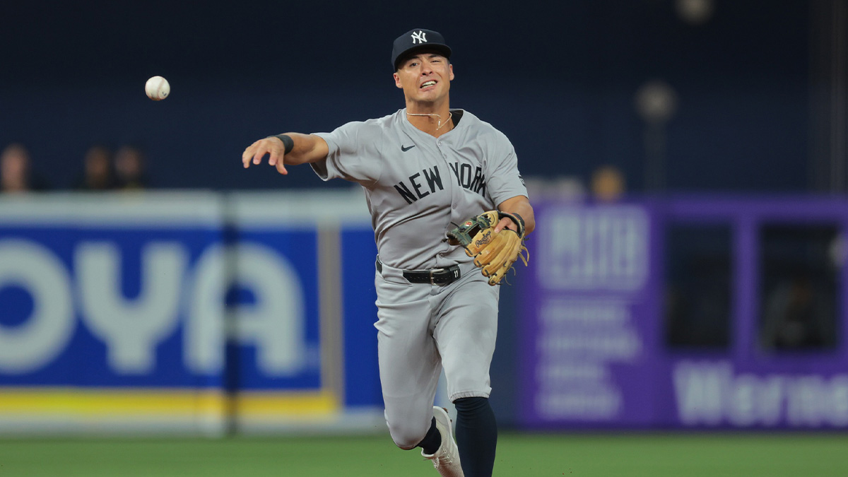 New York Yankees shortstop Anthony Volpe (11) throws to first base to retire Miami Marlins shortstop Otto Lopez (not pictured) during the second inning at loanDepot Park.