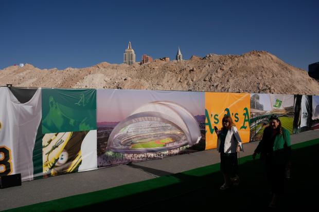 People arrive at a groundbreaking ceremony for the Athletics' baseball stadium Monday, June 23, 2025, in Las Vegas. (AP Photo/John Locher)