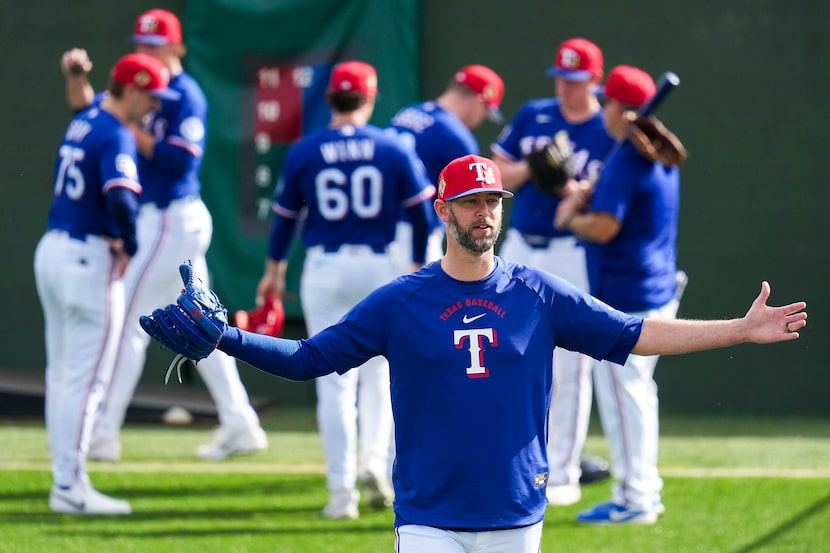 Texas Rangers pitcher Chris Martin motions from the bullpen during a spring training workout...