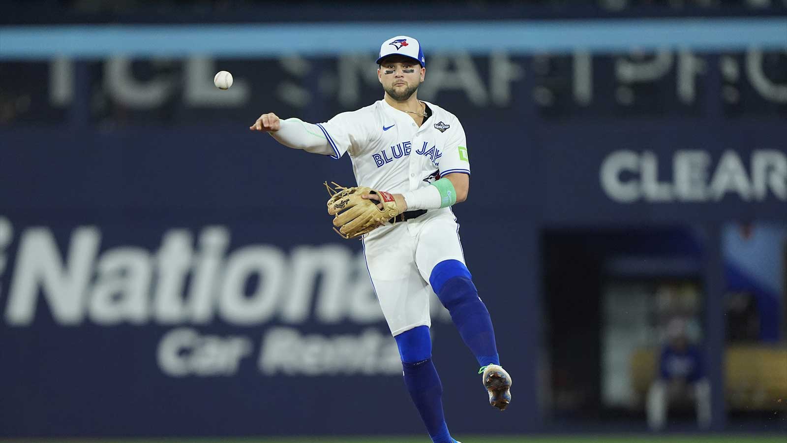 Toronto Blue Jays designated hitter Bo Bichette (11) throws to first for an out against Los Angeles Dodgers right fielder Teoscar Hernandez (37) in the eighth inning during game seven of the 2025 MLB World Series at Rogers Centre.