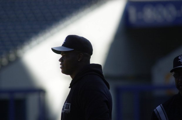 Frank Thomas takes practice in the outfield ahead of a White Sox playoff game at Comiskey Park on Oct. 2, 2000. (Nancy Stone/Tribune)