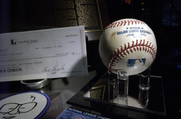 The infamous baseball from Game 6 of the 2003 National League Championship Series against the Florida Marlins at Wrigley Field was on display at Harry Caray's restaurant in downtown Chicago in early 2004. Grant DePorter, manager of the restaurant, purchased the ball on Dec. 19, 2003, from Mastronet Inc. for the price of $113,824.16 and raised more than a million dollars for charity to destroy it. (Bonnie Trafelet/Chicago Tribune)