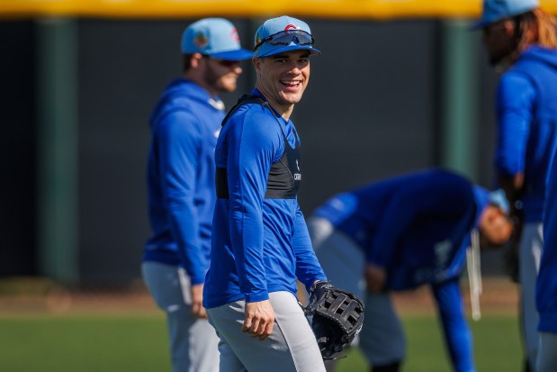 Matt Shaws smiles while throwing in the outfield during Cubs spring training at Sloan Park on Feb. 19, 2026, in Mesa, Ariz. (Armando L. Sanchez/Chicago Tribune)