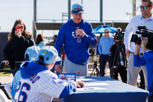 Cubs manager Craig Counsell talks with Advocate Children's Hospital patients after they signed one-day contracts during spring training at Sloan Park on Feb. 19, 2026 in Mesa, Ariz. (Armando L. Sanchez/Chicago Tribune)