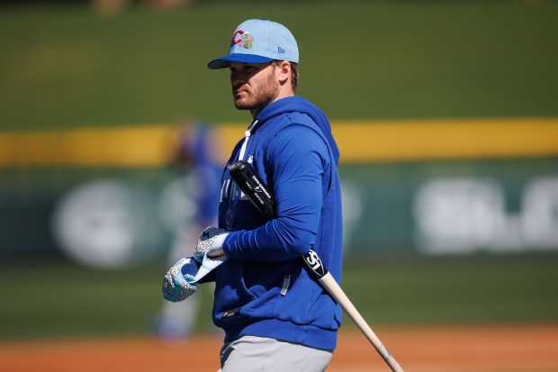Cubs left fielder Ian Happ walks on the field during batting practice at spring training at Sloan Park on Feb. 19, 2026, in Mesa, Ariz. (Armando L. Sanchez/Chicago Tribune)