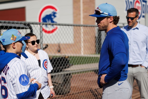 Cubs second baseman Nico Hoerner talks with Advocate Children's Hospital patients after they signed one-day contracts during spring training at Sloan Park on Feb. 19, 2026 in Mesa, Ariz. (Armando L. Sanchez/Chicago Tribune)