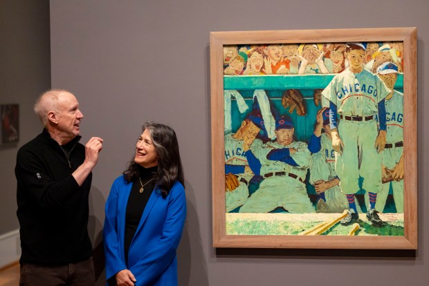 Former Gov. Bruce Rauner and wife, Diana, speak after the installation of Norman Rockwell's painting "The Dugout," featuring the Cubs, Feb. 10, 2026, at the Art Institute of Chicago. The Rauners gifted it to the museum after hanging it in their home for the past 19 years. (Brian Cassella/Chicago Tribune)