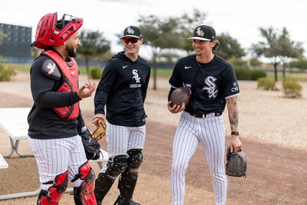White Sox catcher Edgar Quero, from left, bullpen catcher Bennett Markinson and starter Davis Martin joke around during spring training at Camelback Ranch on Feb. 18, 2026, in Glendale, Ariz. (Eileen T. Meslar/Chicago Tribune)