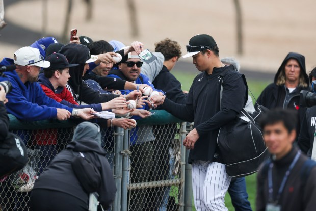 White Sox infielder Munetaka Murakami signs autographs during spring training at Camelback Ranch on Feb. 18, 2026, in Glendale, Ariz. (Eileen T. Meslar/Chicago Tribune)