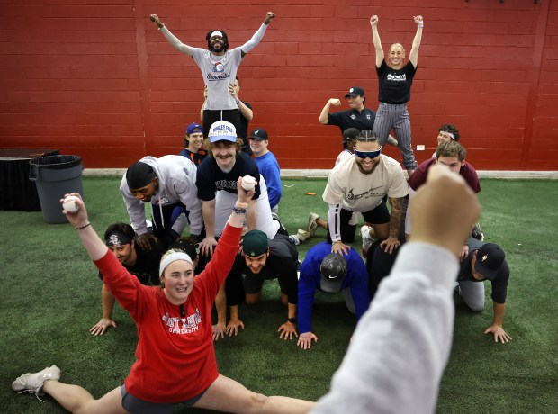 Players Laila Summers, lower left, Maximus Bullock, top left, and Avry Blume, top right, learn a dance routine during the first practice for the Chicago Snowballs baseball team on Feb. 17, 2026, at The Dome at the Parkway Bank Sports Complex in Rosemont. (Chris Sweda/Chicago Tribune)