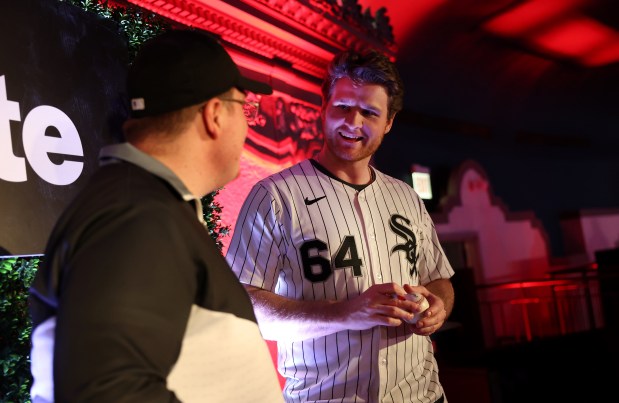 Chicago White Sox pitcher Shane Smith (64) has a laugh with a fan during SoxFest at the Ramova Theatre in Chicago's Bridgeport neighborhood on Friday, Jan. 30, 2026. (Chris Sweda/Chicago Tribune)