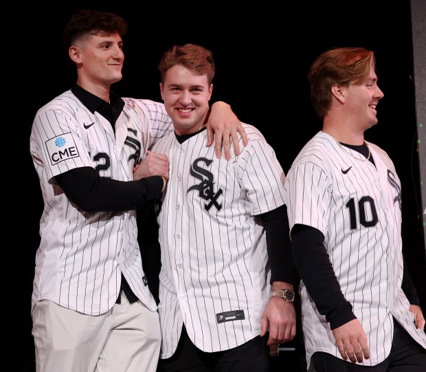 Chicago White Sox shortstop Colson Montgomery (left), catcher Kyle Teel (center), and second baseman Chase Meidroth (10), have some fun on stage after being introduced during SoxFest at the Ramova Theatre in Chicago's Bridgeport neighborhood on Friday, Jan. 30, 2026. (Chris Sweda/Chicago Tribune)
