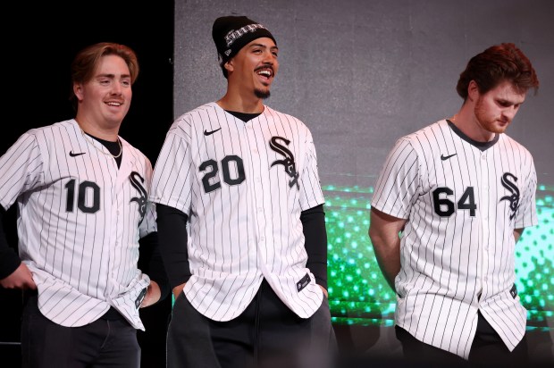 Chicago White Sox second baseman Chase Meidroth (10), third baseman Miguel Vargas (20), and pitcher Shane Smith (64), stand on stage after being introduced during SoxFest at the Ramova Theatre in Chicago's Bridgeport neighborhood on Friday, Jan. 30, 2026. (Chris Sweda/Chicago Tribune)