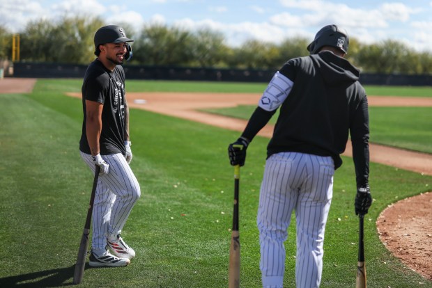 Chicago White Sox center fielder Everson Pereira, left, laughs with second baseman Lenyn Sosa as they wait to take live batting practice during Spring Training at Camelback Ranch-Glendale in Phoenix, Ariz., on Tuesday, Feb. 17, 2026. (Eileen T. Meslar/Chicago Tribune)