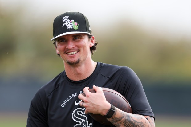 White Sox pitcher Davis Martin warms up with a football during spring training at Camelback Ranch on Monday, Feb. 16, 2026, in Glendale, Ariz. (Eileen T. Meslar/Chicago Tribune)