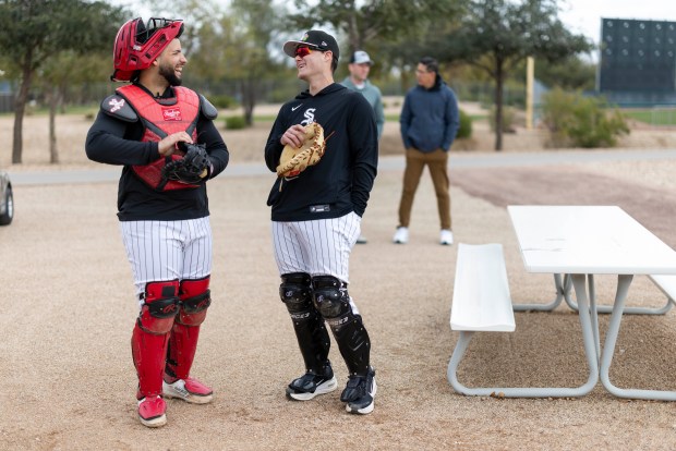 Chicago White Sox catcher Edgar Quero, left, laughs with bullpen catcher Bennett Markinson during spring training at Camelback Ranch in Glendale, Ariz., on Wednesday, Feb. 18, 2026. (Eileen T. Meslar/Chicago Tribune)