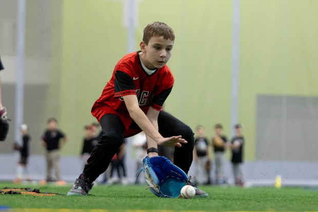 A young boy fields a ball during SoxFest Kids Camp at the ComEd Recreation Center at Addams Park in Chicago on Saturday, Jan. 31, 2026. (Josh Boland/Chicago Tribune)