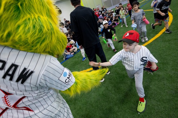 Southpaw slaps hands with a young player during SoxFest Kids Camp at the ComEd Recreation Center at Addams Park in Chicago on Saturday, Jan. 31, 2026. (Josh Boland/Chicago Tribune) 