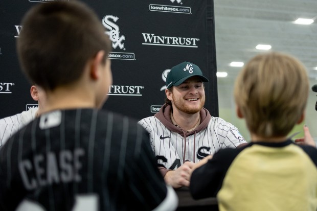 Chicago White Sox pitcher Shane Smith, center, smiles as he speaks with young fans during the Chicago White Sox SoxFest Kids Camp Saturday, Jan. 31, 2026, at the ComEd Recreation Center at Addams Park in Chicago. The event allowed kids to learn baseball from youth academy coaches and current White Sox players and prospects. (Josh Boland/Chicago Tribune)