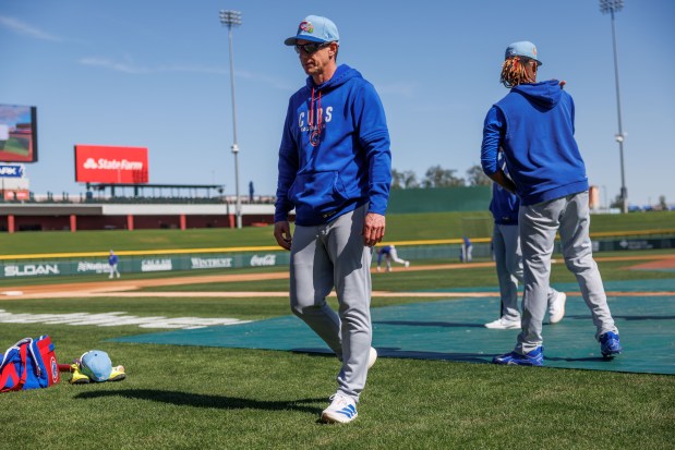 Cubs manager Craig Counsell walks on the field during batting practice during spring training at Sloan Park on Feb. 19, 2026, in Mesa, Ariz. (Armando L. Sanchez/Chicago Tribune)
