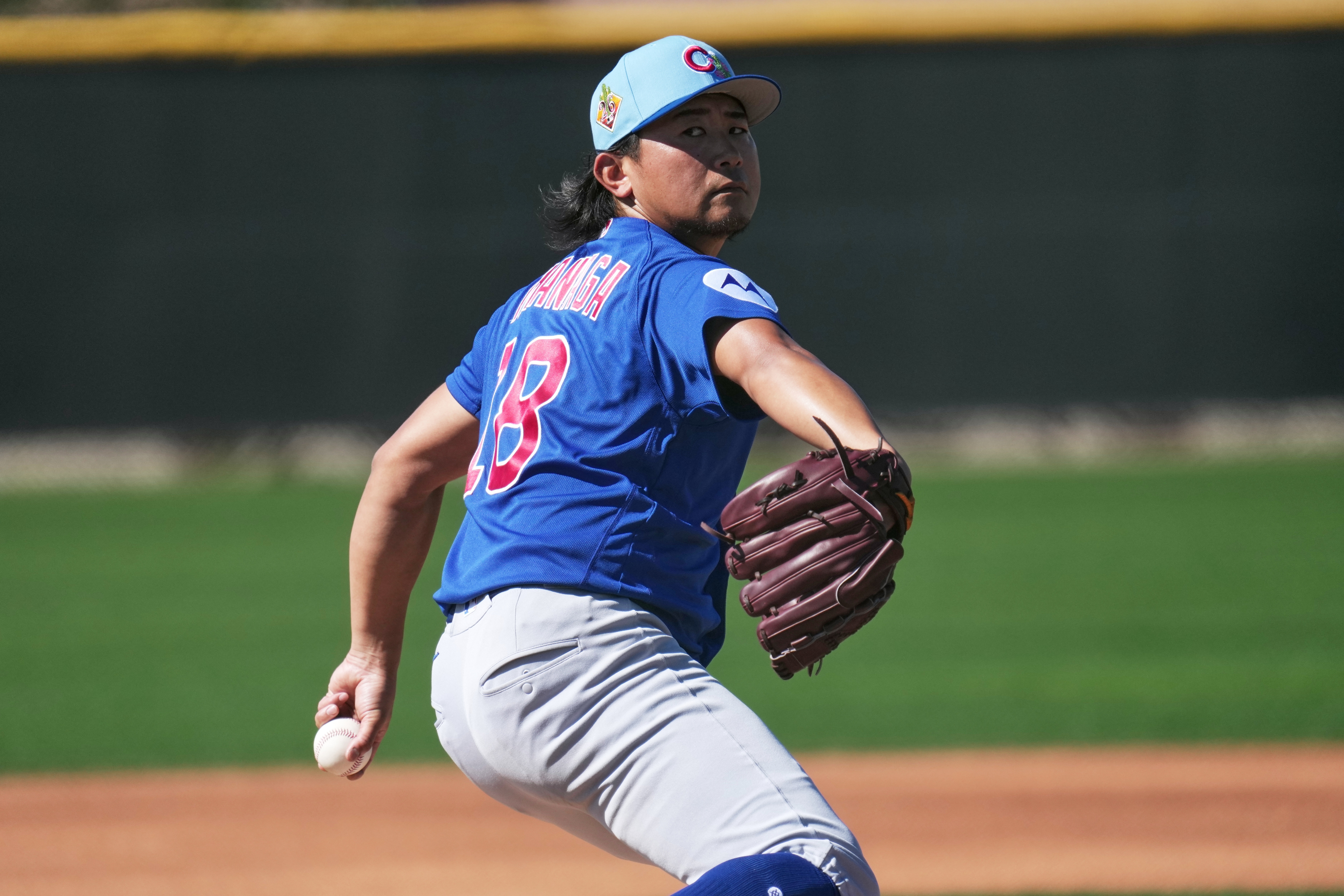 Cubs starter Shota Imanaga throws during a spring training workout...