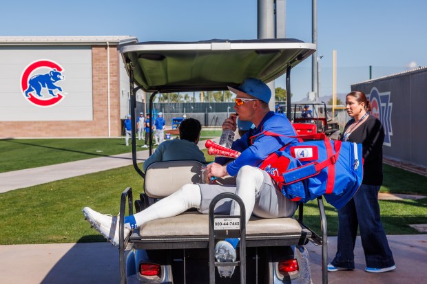 Cubs center fielder Pete Crow-Armstrong rides a golf cart to batting practice during spring training at Sloan Park on Feb. 19, 2026, in Mesa, Ariz. (Armando L. Sanchez/Chicago Tribune)